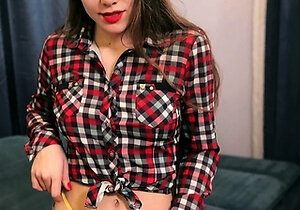 Slim and sexy Nika Flamy on a sofa