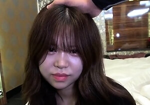 A video of Sakura, a fair-skinned and slender teenager,