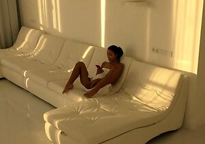 Black Asian Teen jumping on red cock in white room